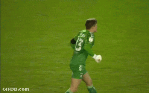 A Soccer Player Wearing A Green Jersey With The Number 13 On It Is Standing On The Field . GIF