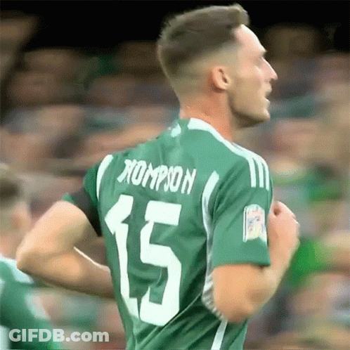 A Soccer Player Wearing A Green Jersey With The Number 15 On The Back GIF