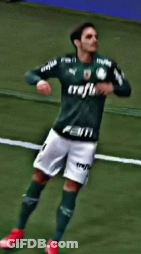 A Soccer Player Wearing A Green Jersey With The Number 28 On It GIF