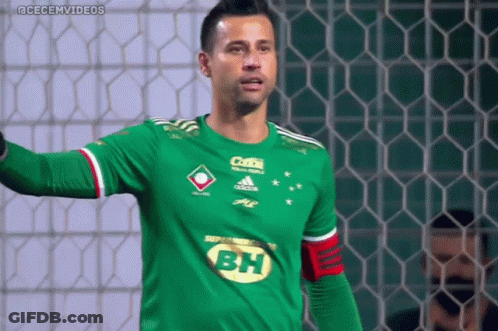 A Soccer Player Wearing A Green Shirt With Bh On The Front GIF