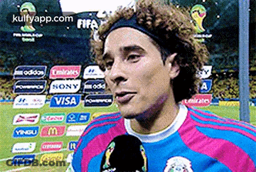 A Soccer Player Wearing A Headband Is Talking Into A Microphone GIF