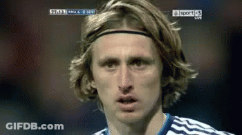A Soccer Player Wearing A Headband Looks At The Camera During A Game GIF