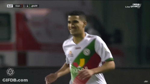 A Soccer Player Wearing A Jako Jersey Celebrates With Another Player GIF