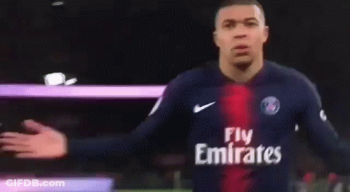 A Soccer Player Wearing A Jersey That Says Fly Emirates On It GIF