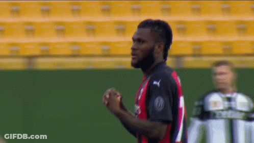 A Soccer Player Wearing A Jersey That Says Fly Emirates On The Front GIF