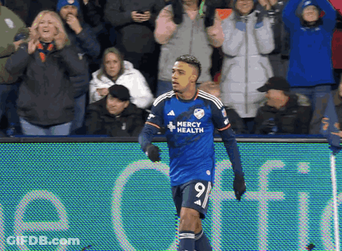 A Soccer Player Wearing A Jersey That Says Mercy Health On It GIF