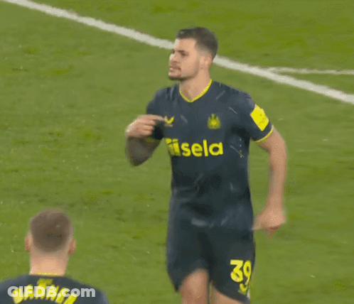 A Soccer Player Wearing A Jersey That Says Noon On The Arm GIF