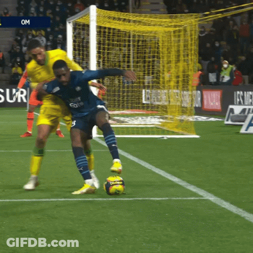 A Soccer Player Wearing A Jersey That Says Uber Eats On It Kicks The Ball GIF