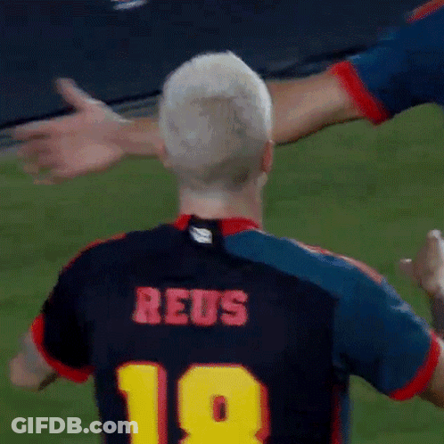 A Soccer Player Wearing A Jersey With The Number 18 On It GIF