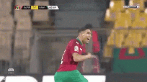 A Soccer Player Wearing A Jersey With The Number 2 On It Is Running On The Field . GIF