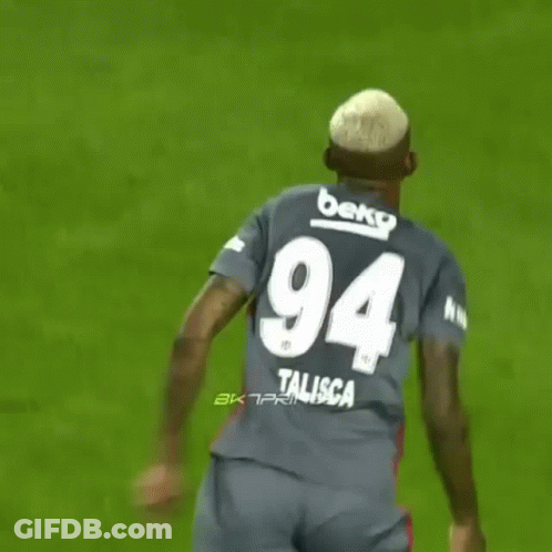 A Soccer Player Wearing A Jersey With The Number 94 On The Back GIF