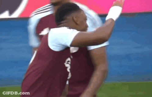 A Soccer Player Wearing A Maroon Jersey With A White Letter G On The Back GIF