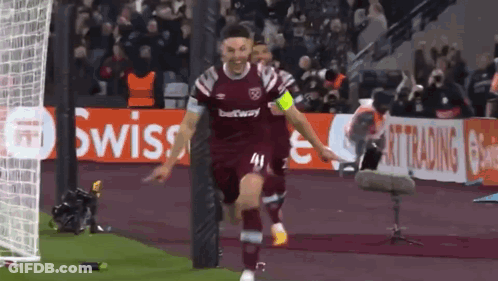 A Soccer Player Wearing A Maroon Jersey With The Number 41 On It Celebrates A Goal GIF
