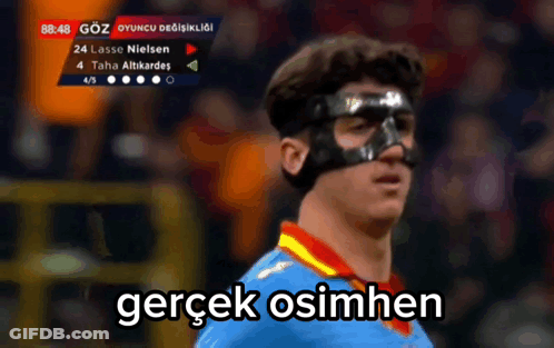 A Soccer Player Wearing A Mask With The Words Gerçek Osimhen Written Below Him GIF