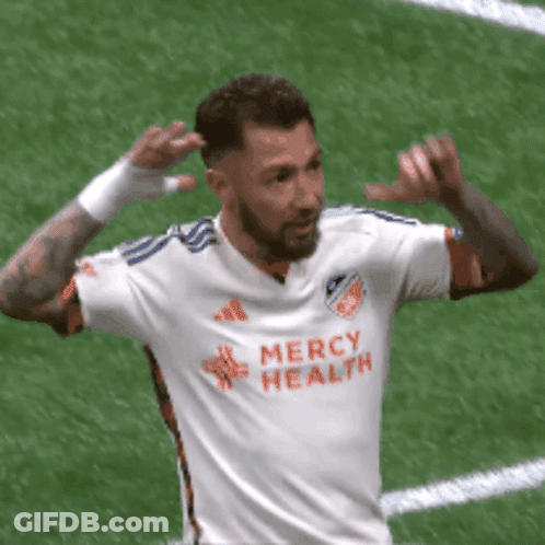 A Soccer Player Wearing A Mercy Health Jersey Celebrates A Goal GIF