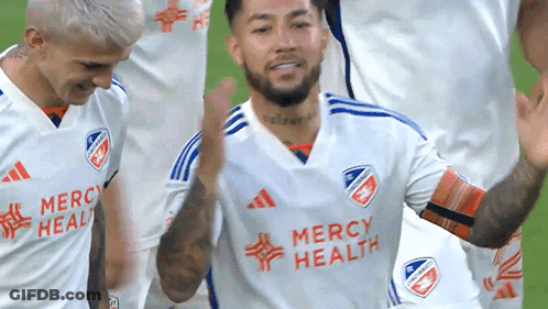 A Soccer Player Wearing A Mercy Health Jersey Celebrates With His Teammates GIF
