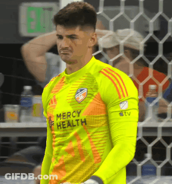 A Soccer Player Wearing A Mercy Health Jersey Stands In Front Of A Net GIF