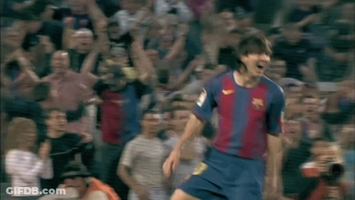 A Soccer Player Wearing A Nike Jersey Is Celebrating A Goal In Front Of A Crowd GIF