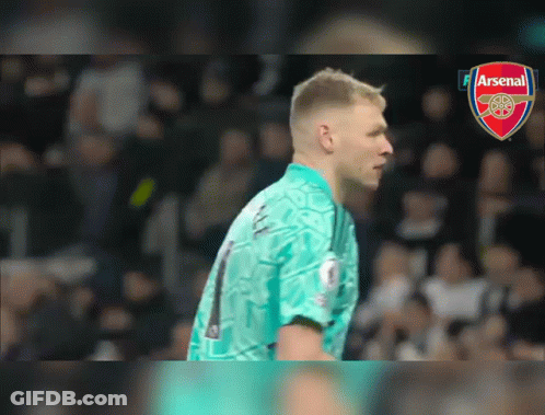 A Soccer Player Wearing A Number 1 Jersey Stands In Front Of An Arsenal Logo GIF