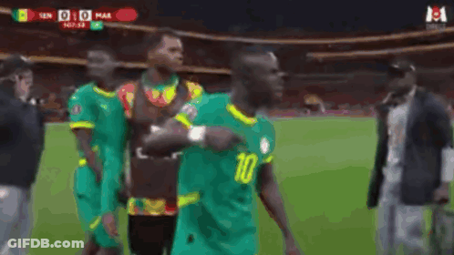 A Soccer Player Wearing A Number 10 Jersey Is Dancing On The Field GIF