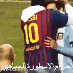 A Soccer Player Wearing A Number 10 Jersey Is Hugging Another Player GIF