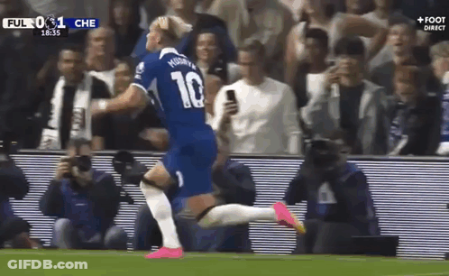 A Soccer Player Wearing A Number 10 Jersey Is Running On The Field . GIF