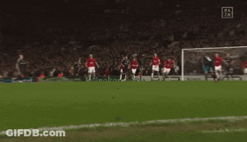 A Soccer Player Wearing A Number 10 Jersey Kicks The Ball GIF