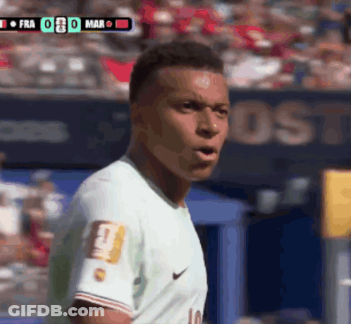 A Soccer Player Wearing A Number 10 Jersey Stands In Front Of A Scoreboard GIF