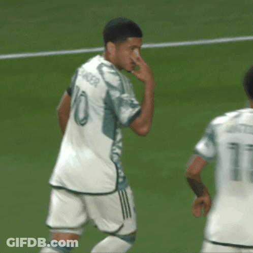 A Soccer Player Wearing A Number 10 Jersey Wipes His Nose GIF