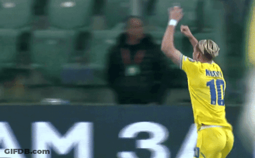 A Soccer Player Wearing A Number 11 Jersey Celebrates A Goal GIF