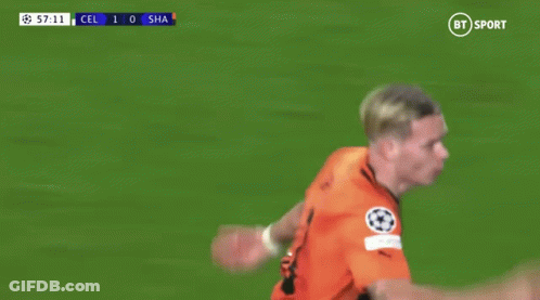 A Soccer Player Wearing A Number 11 Jersey Is Running On The Field GIF