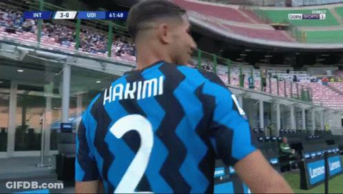 A Soccer Player Wearing A Number 2 Jersey Stands In A Stadium GIF