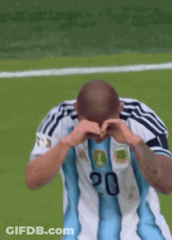 A Soccer Player Wearing A Number 20 Jersey Is Making A Heart Shape With His Hands GIF
