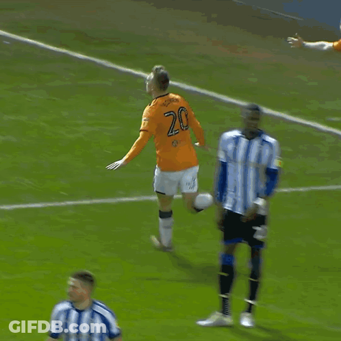 A Soccer Player Wearing A Number 21 Jersey Jumps In The Air GIF