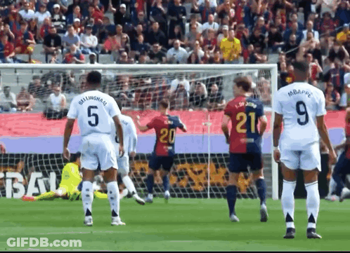 A Soccer Player Wearing A Number 21 Jersey Stands On The Field GIF