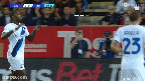 A Soccer Player Wearing A Number 23 Jersey Stands Next To Another Player GIF