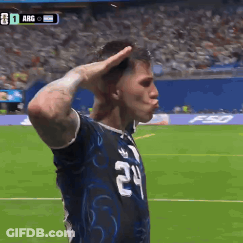 A Soccer Player Wearing A Number 24 Jersey Salutes The Crowd GIF