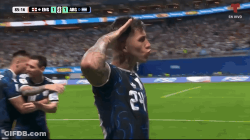 A Soccer Player Wearing A Number 24 Jersey Salutes The Crowd GIF