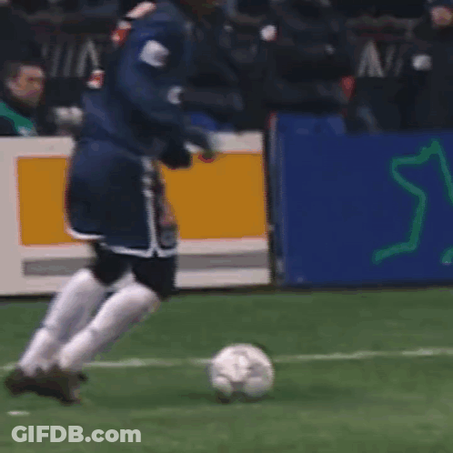A Soccer Player Wearing A Number 27 Jersey Kicks The Ball GIF