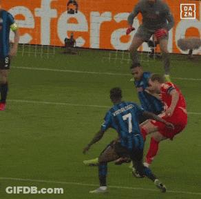 A Soccer Player Wearing A Number 4 Jersey Is Jumping In The Air GIF