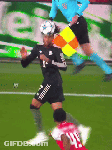 A Soccer Player Wearing A Number 40 Jersey Is Being Tackled By Another Player GIF