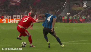 A Soccer Player Wearing A Number 42 Jersey Kicks The Ball GIF