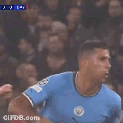 A Soccer Player Wearing A Number 5 Jersey Is Kicking The Ball GIF