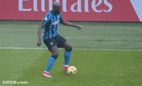 A Soccer Player Wearing A Number 7 Jersey Is Being Tackled By Another Player GIF