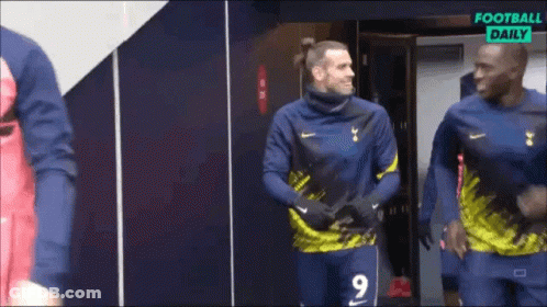 A Soccer Player Wearing A Number 9 Jersey Is Standing In A Locker Room GIF