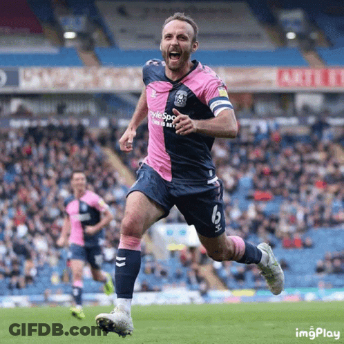 A Soccer Player Wearing A Pink And Blue Uniform With The Number 6 On It GIF