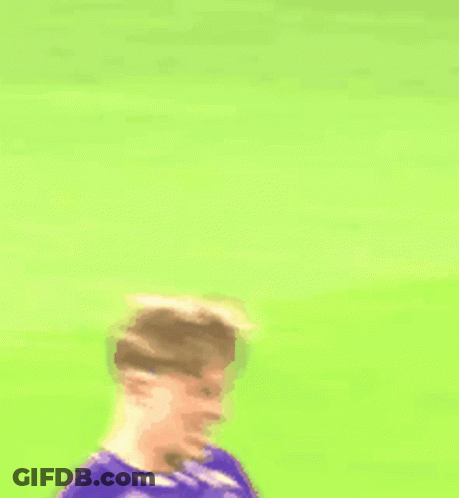 A Soccer Player Wearing A Purple Jersey With A White Circle On The Front GIF