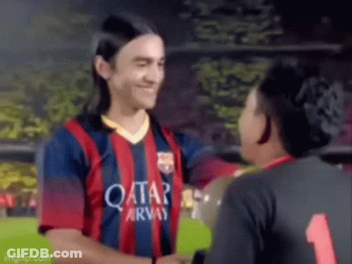A Soccer Player Wearing A Qatar Airways Jersey Is Shaking Hands With Another Player On A Field . GIF
