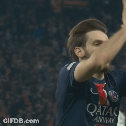 A Soccer Player Wearing A Qatar Airways Jersey Looks Up At The Sky GIF