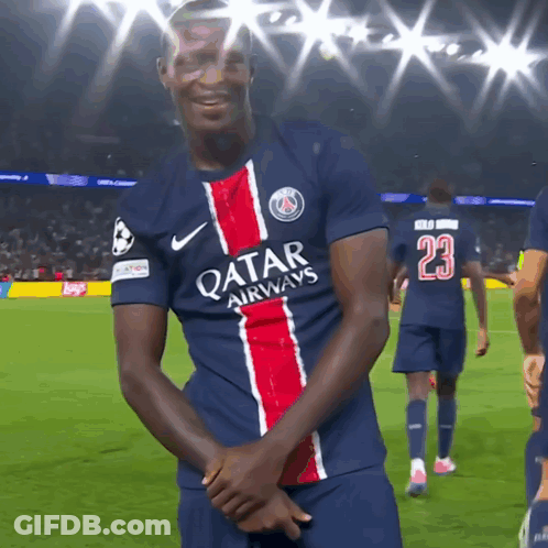 A Soccer Player Wearing A Qatar Airways Jersey Stands On The Field GIF